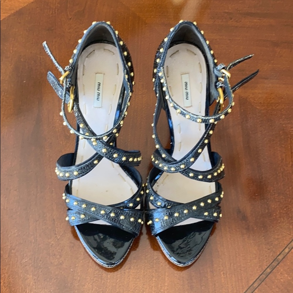 Miu Miu black sandals, gold studs.